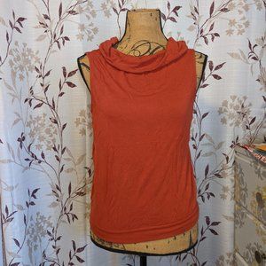 Orange Sleeveless turtleneck.